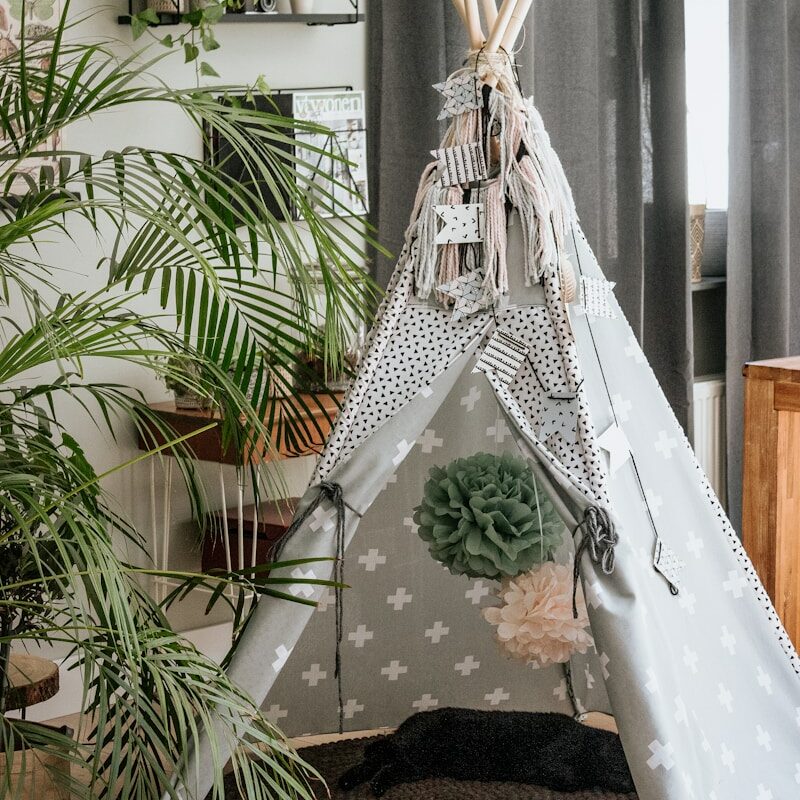 white hammock near green palm plant